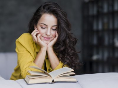 medium-shot-woman-with-book-indoors
